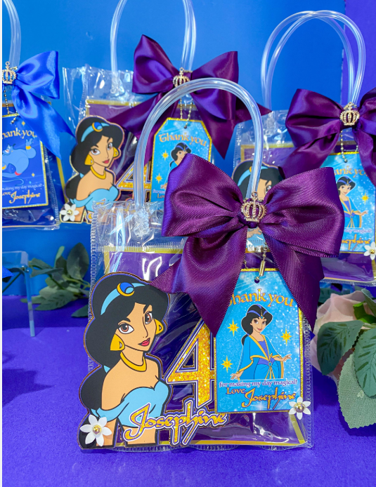 Arabian Princess themed party goodie bags with purple satin ribbon and gold crown charm tags